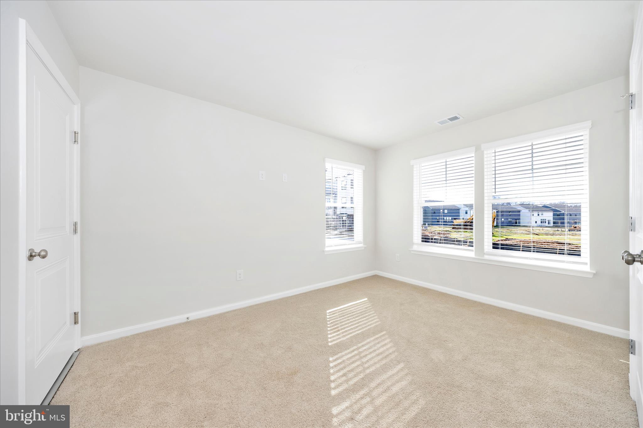 726 Compass Way Frederick, MD 21701 - Photo 6 of 55 a view of an empty room with a window
