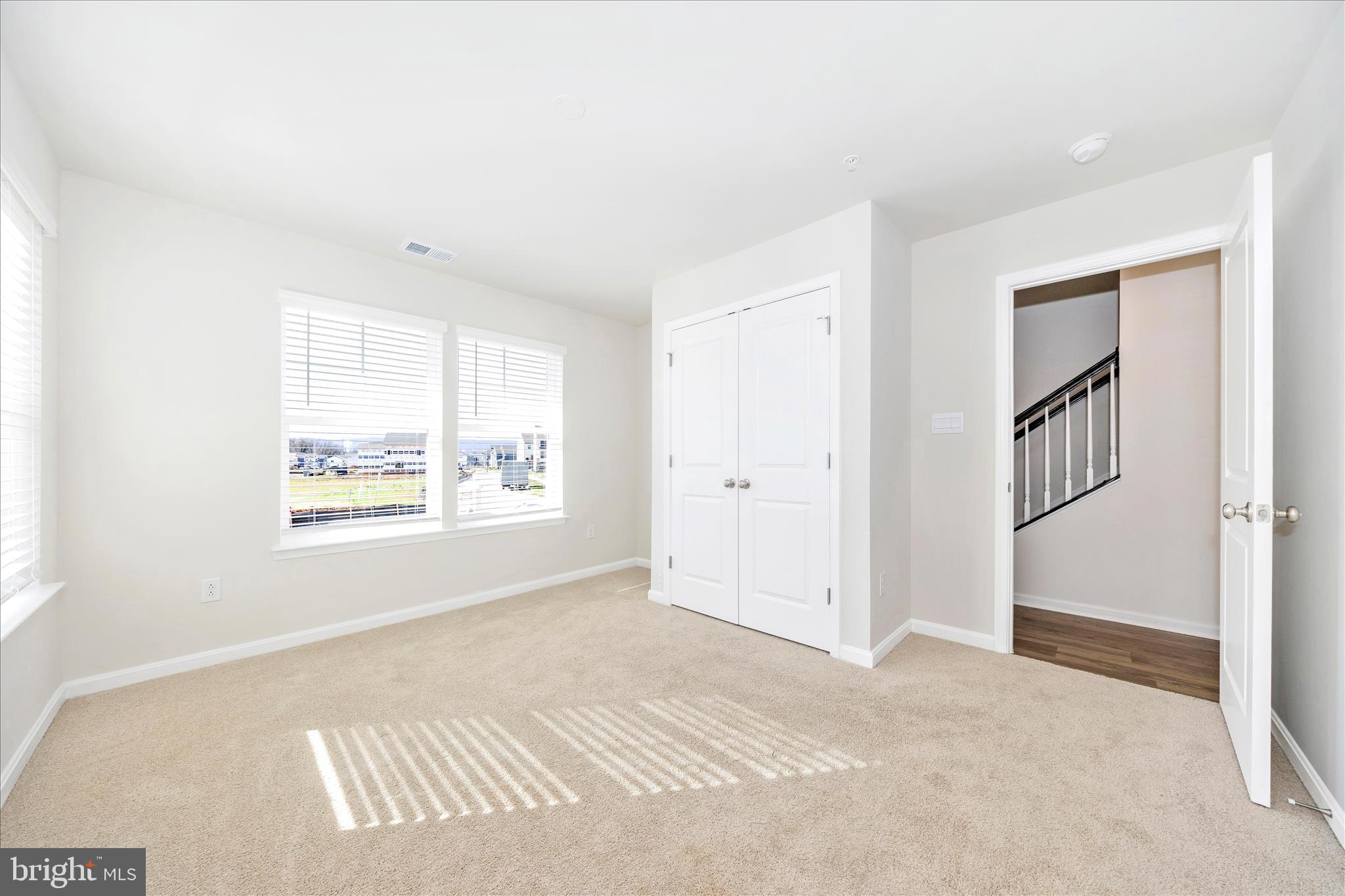 726 Compass Way Frederick, MD 21701 - Photo 7 of 55 a view of an empty room with a window