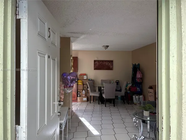 a view of a livingroom with furniture and workspace