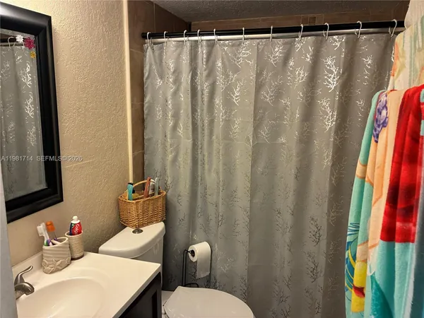 a bathroom with a sink and toilet