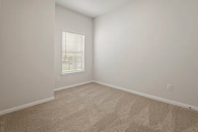a white toilet sitting next to a bath tub