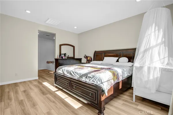 a bedroom with a bed and window
