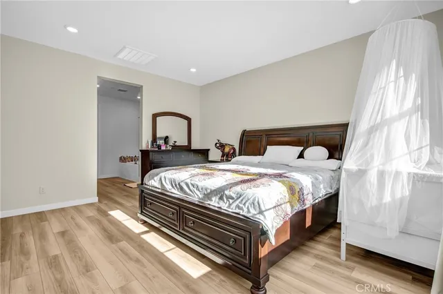 a bedroom with a bed and window