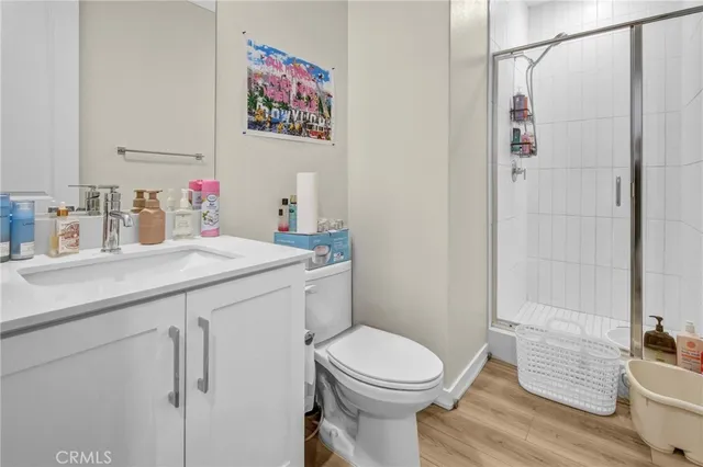a view of a hallway view with wooden floor and staircase