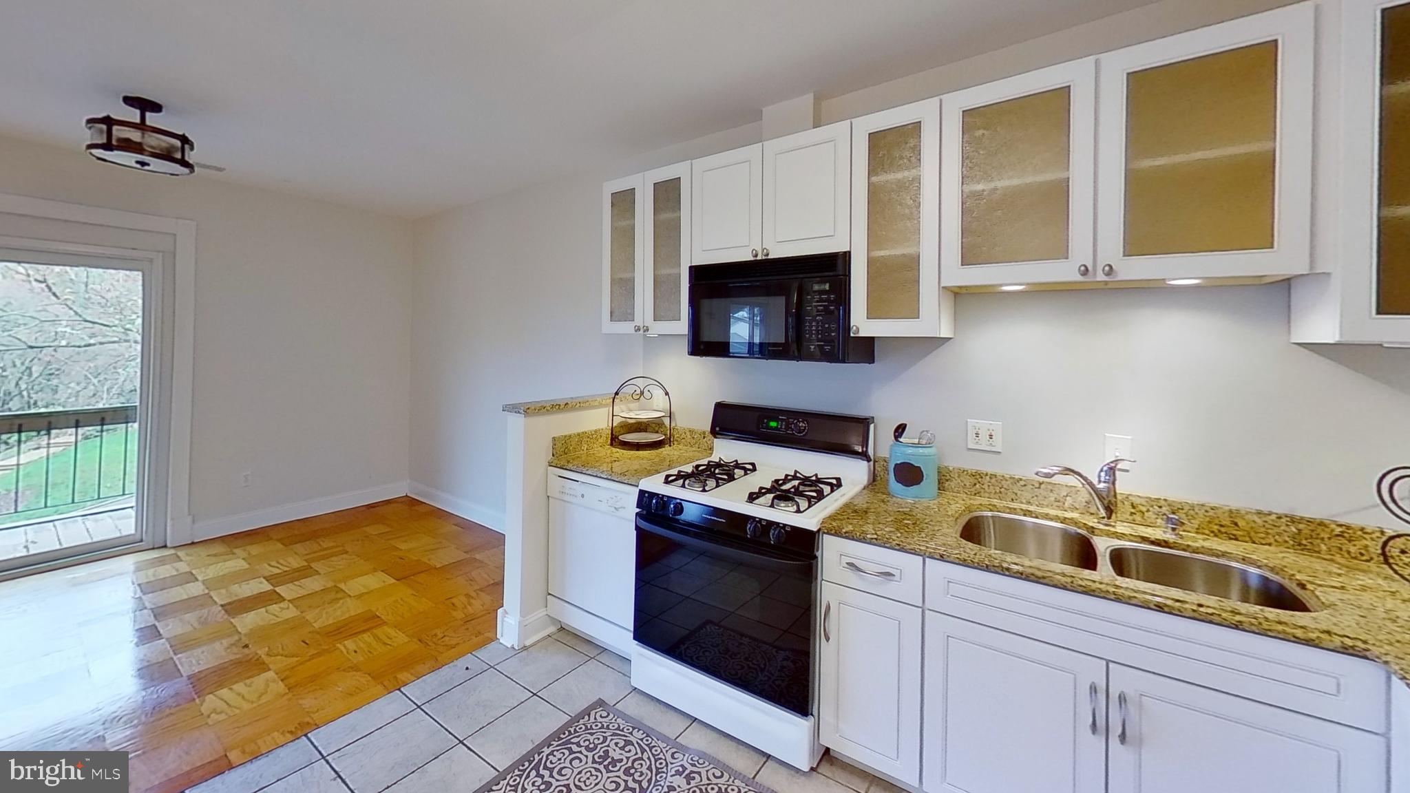 7 Cross Keys Road, Unit 7E Baltimore, MD 21210 - Photo 5 of 40 Kitchen opens to Dining Room