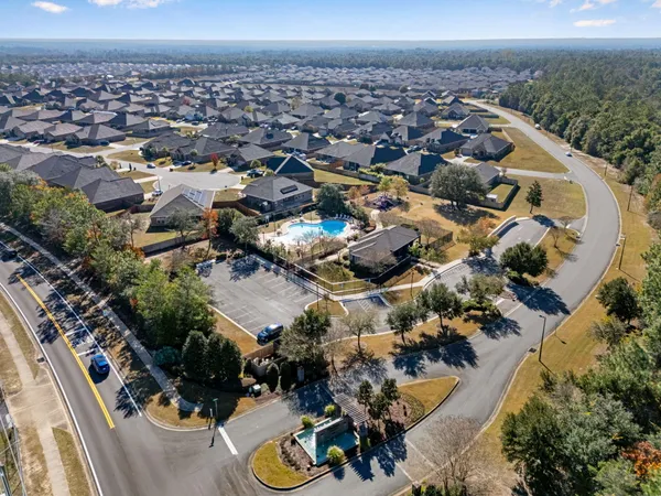 an aerial view of a house with outdoor space