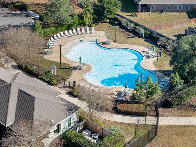 an aerial view of houses with outdoor space