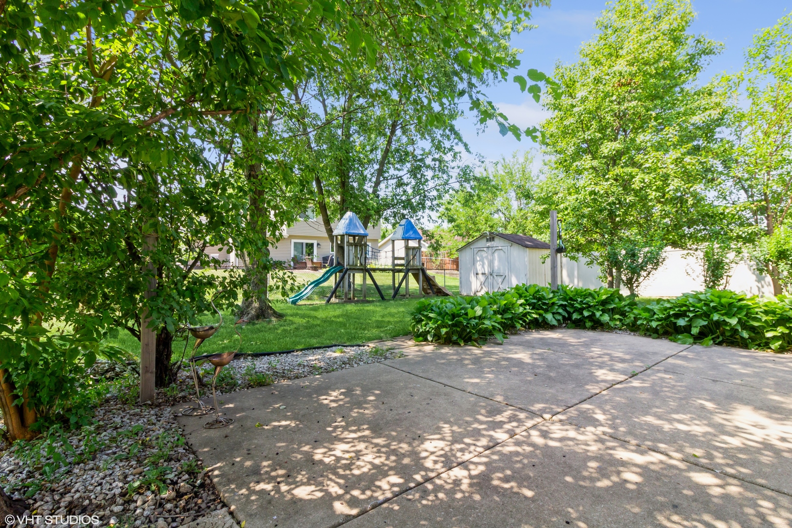 671 Rockhurst Road Bolingbrook, IL 60440 - Photo 13 of 17 a pathway of a house with a yard