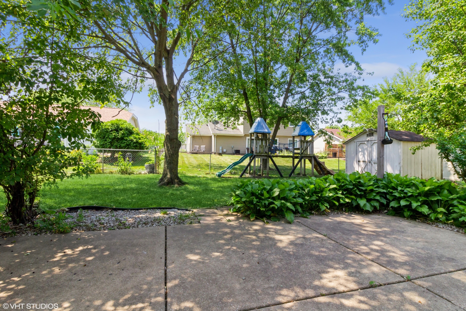 671 Rockhurst Road Bolingbrook, IL 60440 - Photo 14 of 17 a front view of a house with a yard