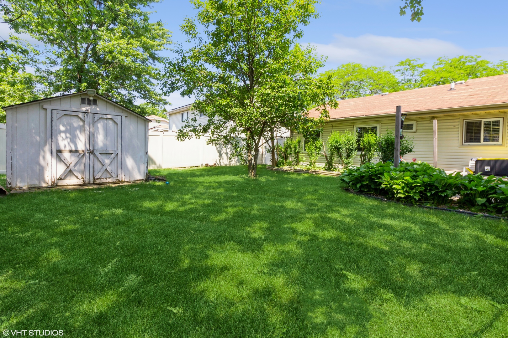 671 Rockhurst Road Bolingbrook, IL 60440 - Photo 16 of 17 a view of an house with backyard space and garden