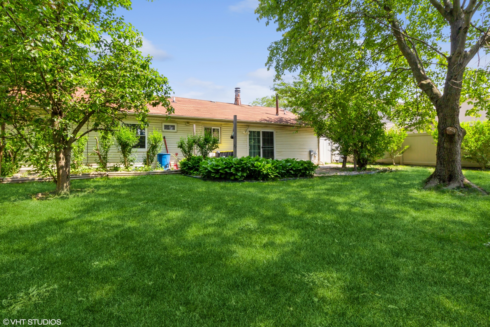 671 Rockhurst Road Bolingbrook, IL 60440 - Photo 17 of 17 a front view of a house with garden