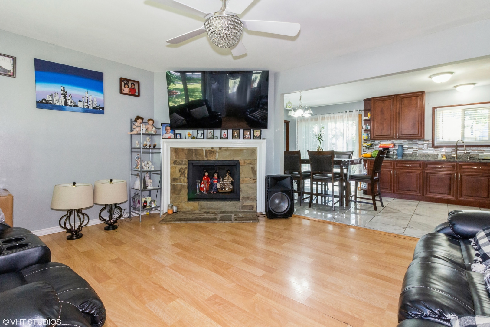 671 Rockhurst Road Bolingbrook, IL 60440 - Photo 3 of 17 a living room with furniture a flat screen tv and a fireplace