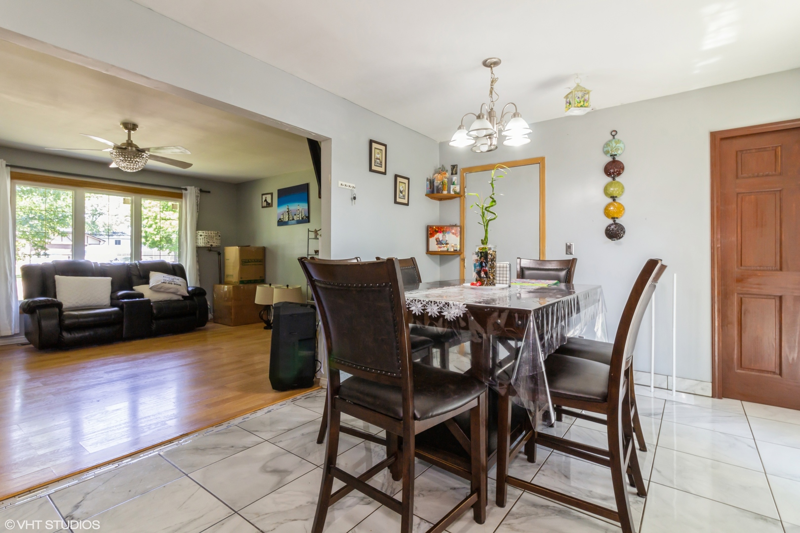 671 Rockhurst Road Bolingbrook, IL 60440 - Photo 8 of 17 a view of a dining room with furniture window and wooden floor
