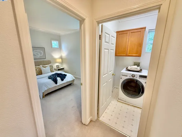 a bedroom with a bed and a view of bedroom