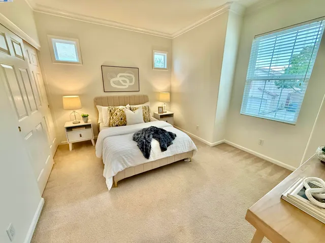 a bedroom with a bed and couch