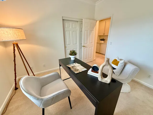 a living room with couches and rug with wooden floor