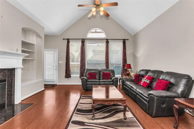 a living room with furniture and a fireplace