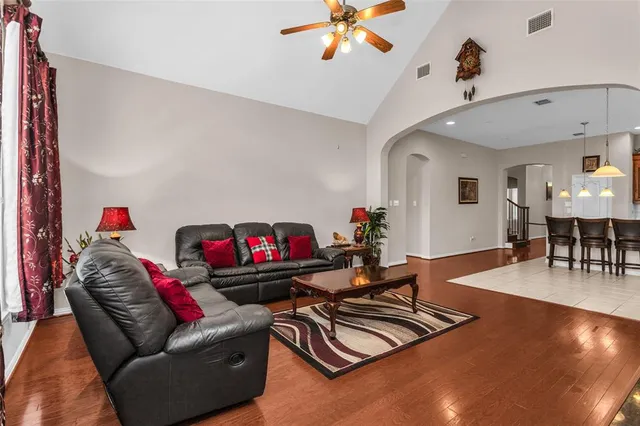 a living room with furniture and a large window