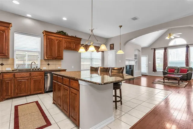 a view of a house with a yard and deck