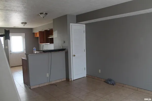 a view of a kitchen with a sink