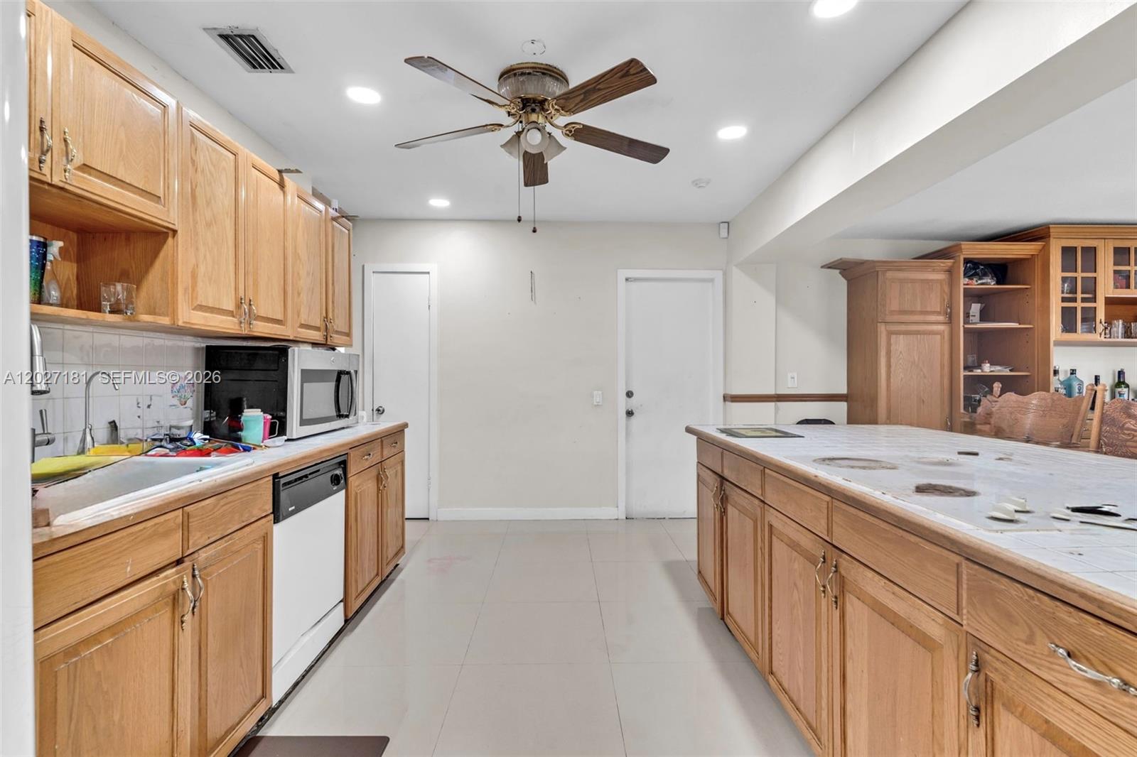 15440 Southwest 294th Terrace Homestead, FL 33033 - Photo 3 of 31 a kitchen with stainless steel appliances granite countertop a sink and cabinets