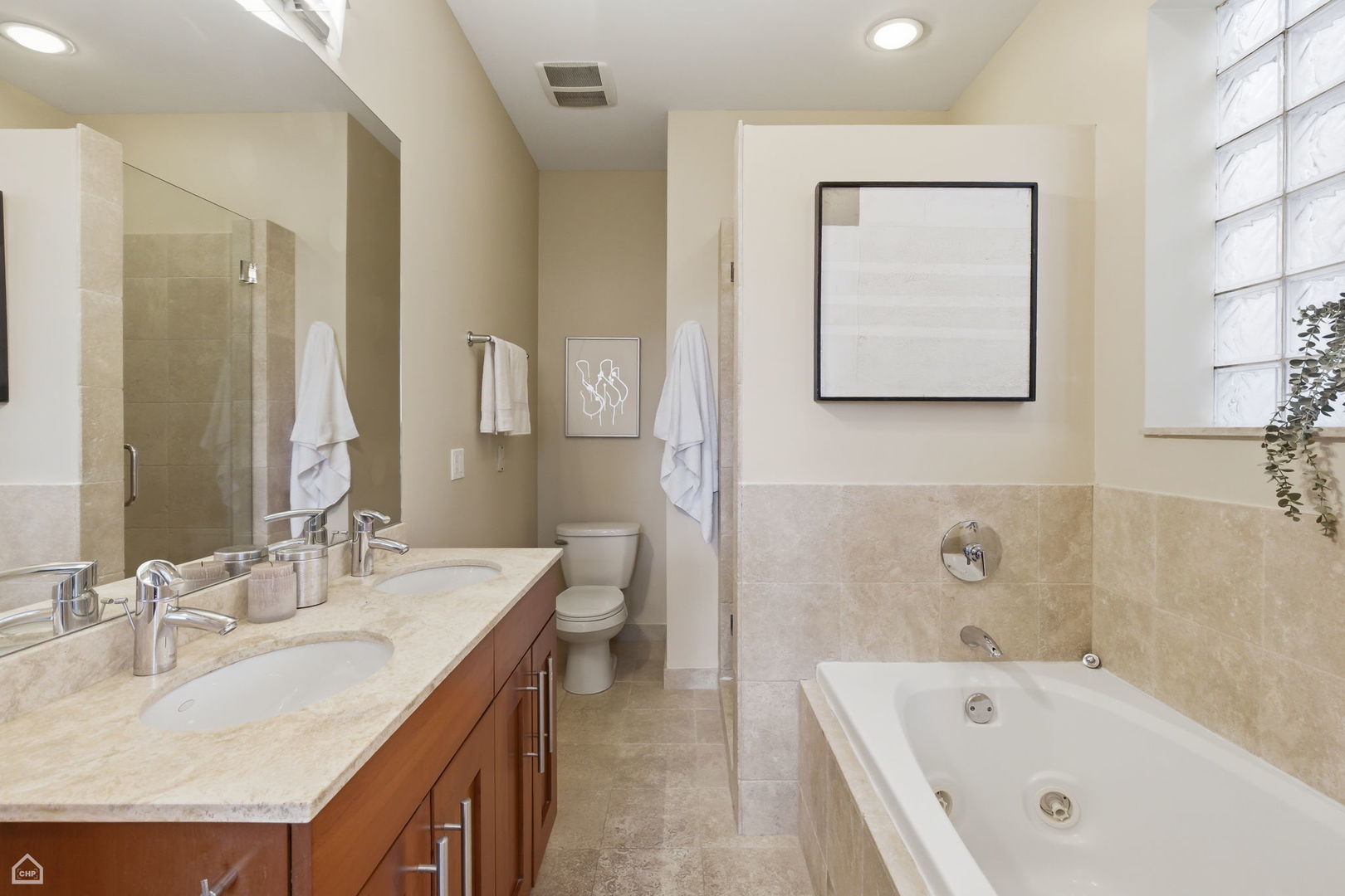 2229 North Leavitt Street, Unit 2 Chicago, IL 60647 - Photo 12 of 19 a bathroom with a tub a sink and mirror