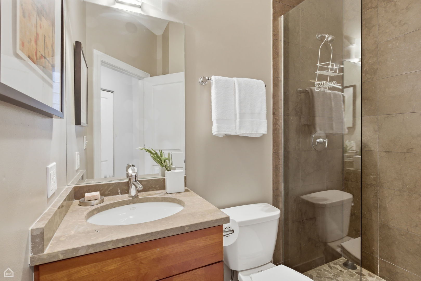 2229 North Leavitt Street, Unit 2 Chicago, IL 60647 - Photo 15 of 19 a bathroom with a sink toilet and shower