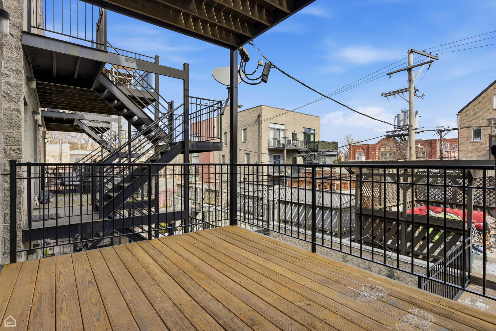 2229 North Leavitt Street, Unit 2 Chicago, IL 60647 - Photo 18 of 19 a view of a balcony with wooden floor