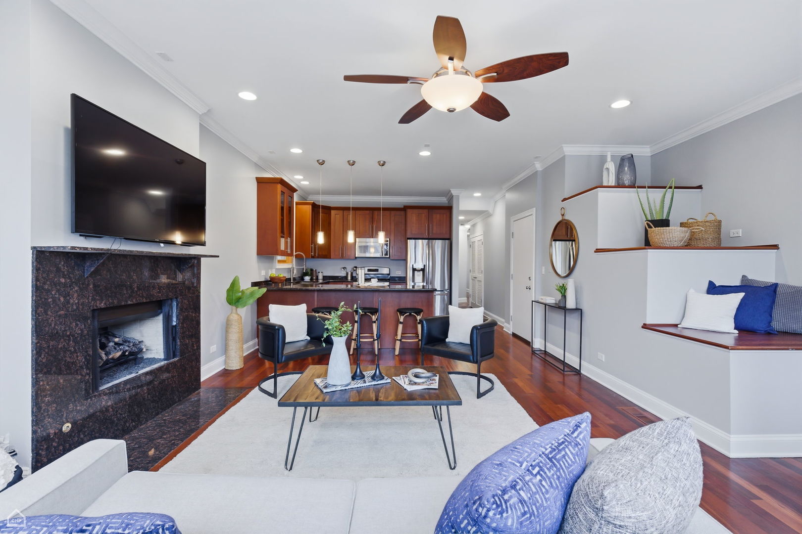2229 North Leavitt Street, Unit 2 Chicago, IL 60647 - Photo 3 of 19 a living room with furniture and a fireplace