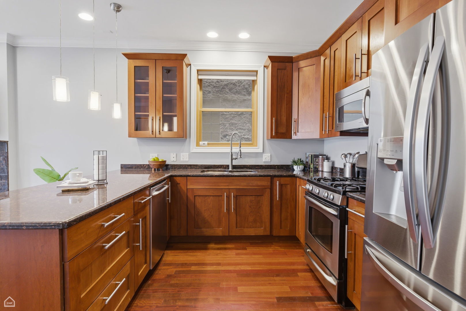 2229 North Leavitt Street, Unit 2 Chicago, IL 60647 - Photo 6 of 19 a kitchen with stainless steel appliances granite countertop a sink stove and refrigerator