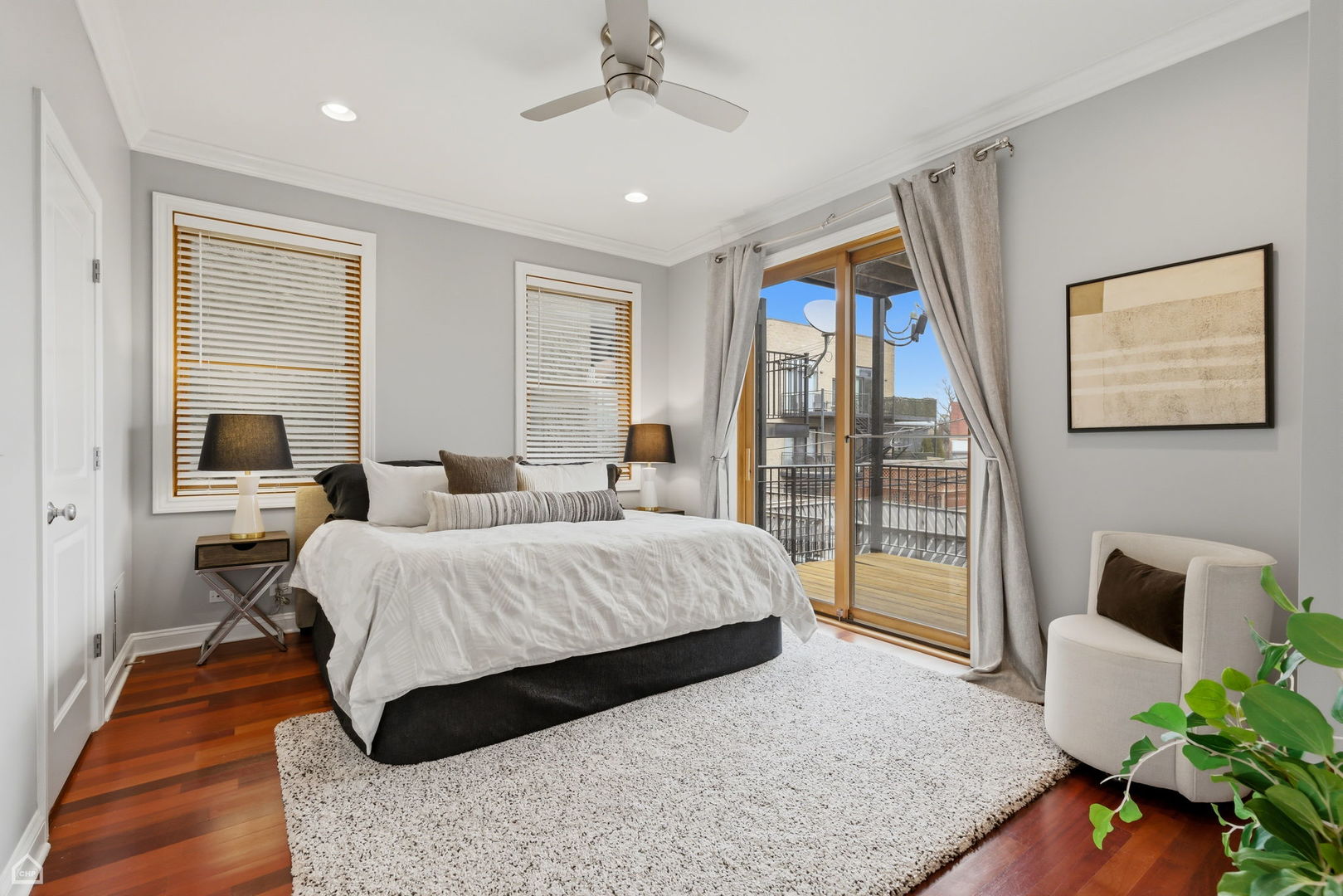 2229 North Leavitt Street, Unit 2 Chicago, IL 60647 - Photo 8 of 19 a bedroom with a large bed and a couch