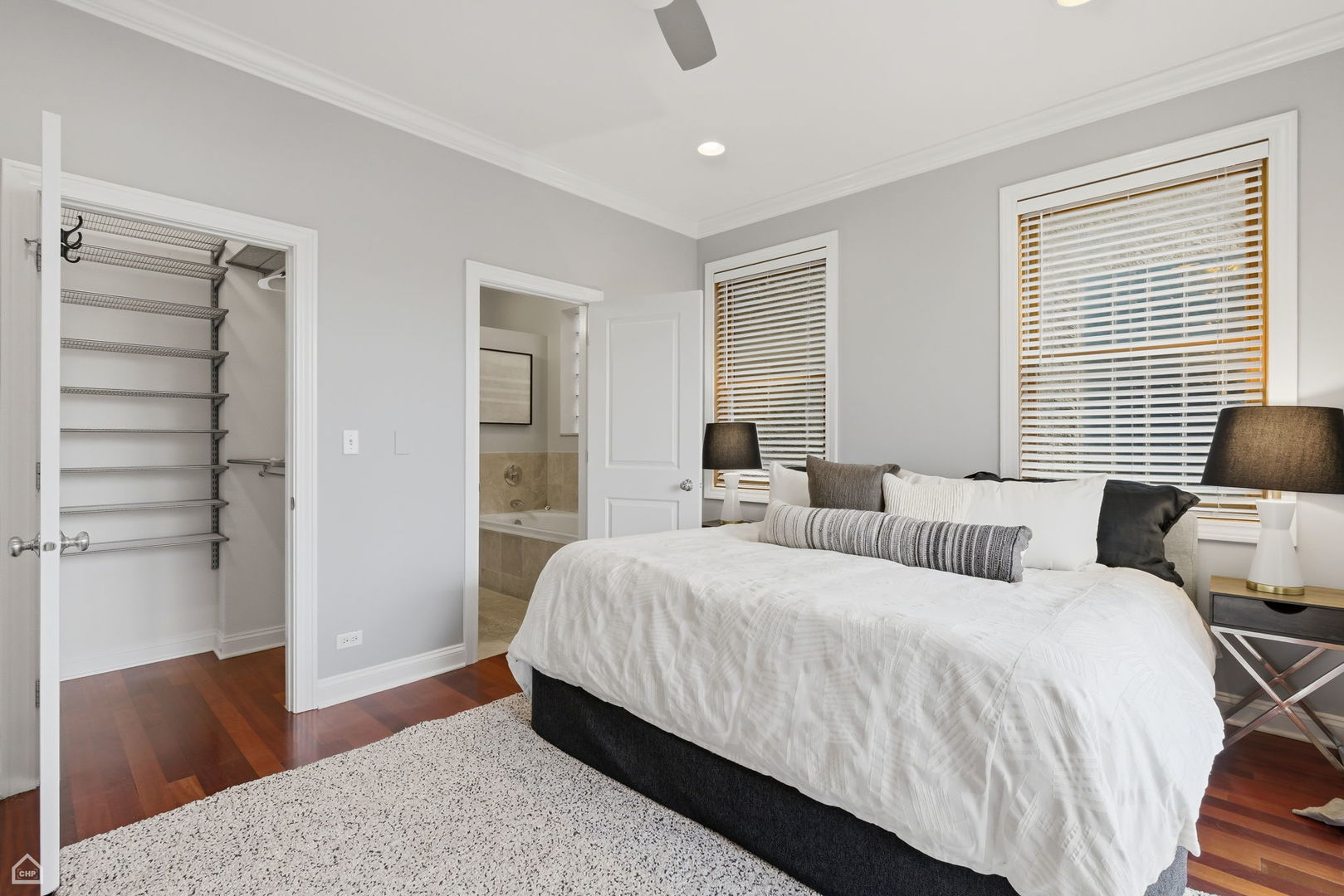 2229 North Leavitt Street, Unit 2 Chicago, IL 60647 - Photo 10 of 19 a bedroom with a bed and wooden floor