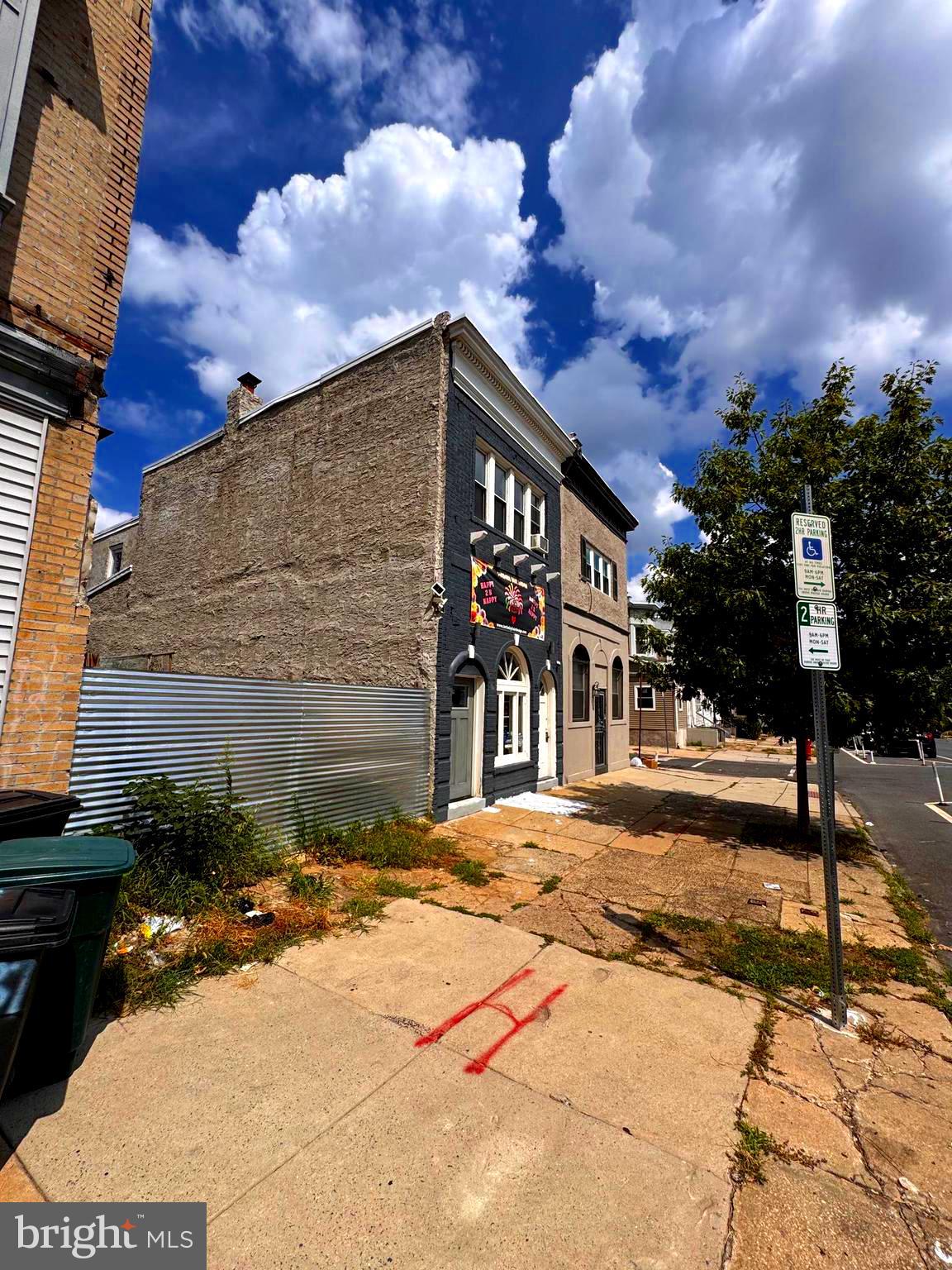 5939 Chestnut Street Philadelphia, PA 19139 - Photo 1 of 8 a front view of a house with a yard