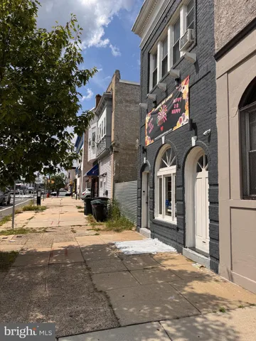 a view of a building with a snow on the road