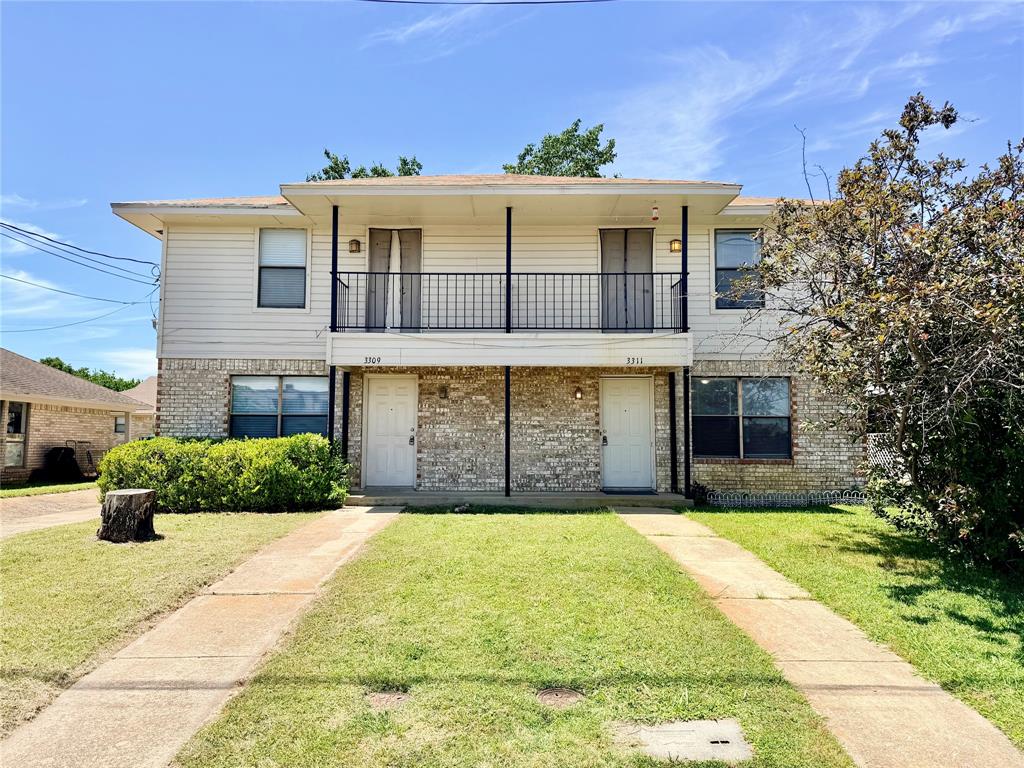 3311 Fallmeadow Street Denton, TX 76207 - Photo 1 of 13 a front view of a house with a yard and garage