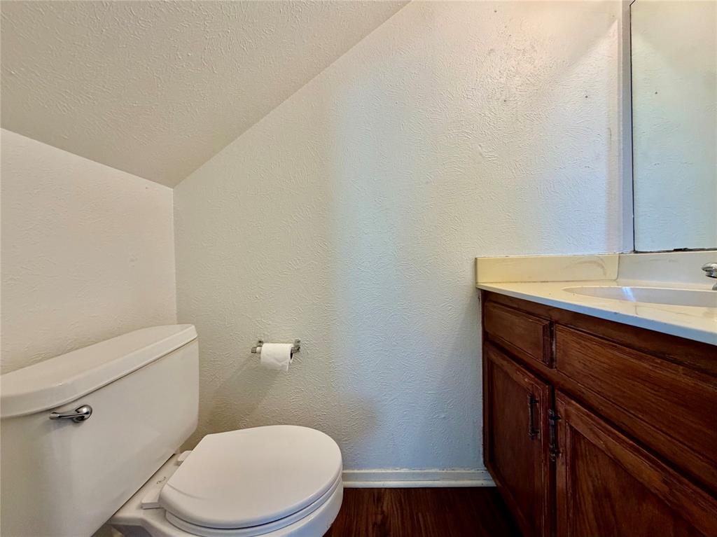 3311 Fallmeadow Street Denton, TX 76207 - Photo 5 of 13 a bathroom with a sink a toilet and vanity