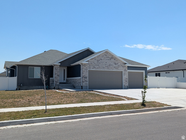 171 South Mustang Road East Grantsville, UT 84029 - Photo 1 of 41 Contemporary ranch-style residence featuring a gray siding and light-toned stone facade
