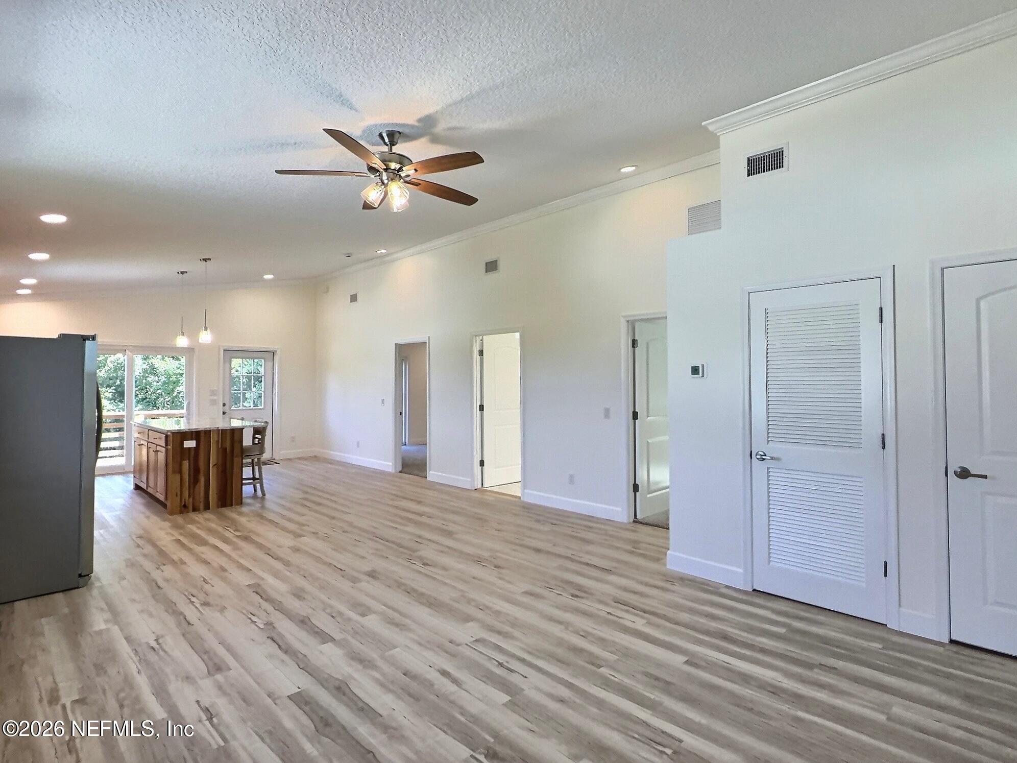 159 Mays Cove Road East Palatka, FL 32131 - Photo 62 of 62 a view of a livingroom with a ceiling fan furniture and ceiling fan