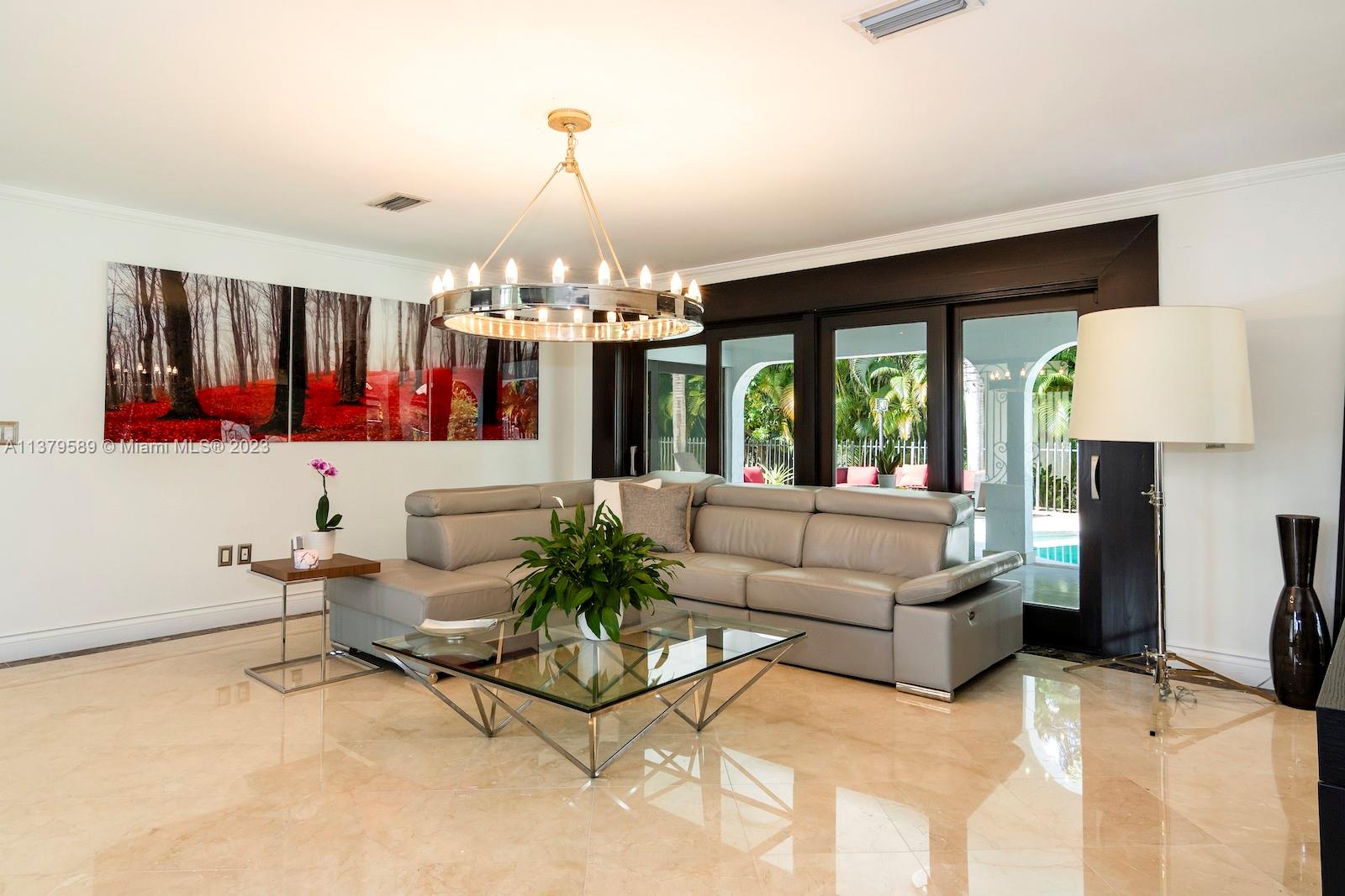 Doral Doral, FL 33178 - Photo 19 of 52 a living room with furniture and a chandelier