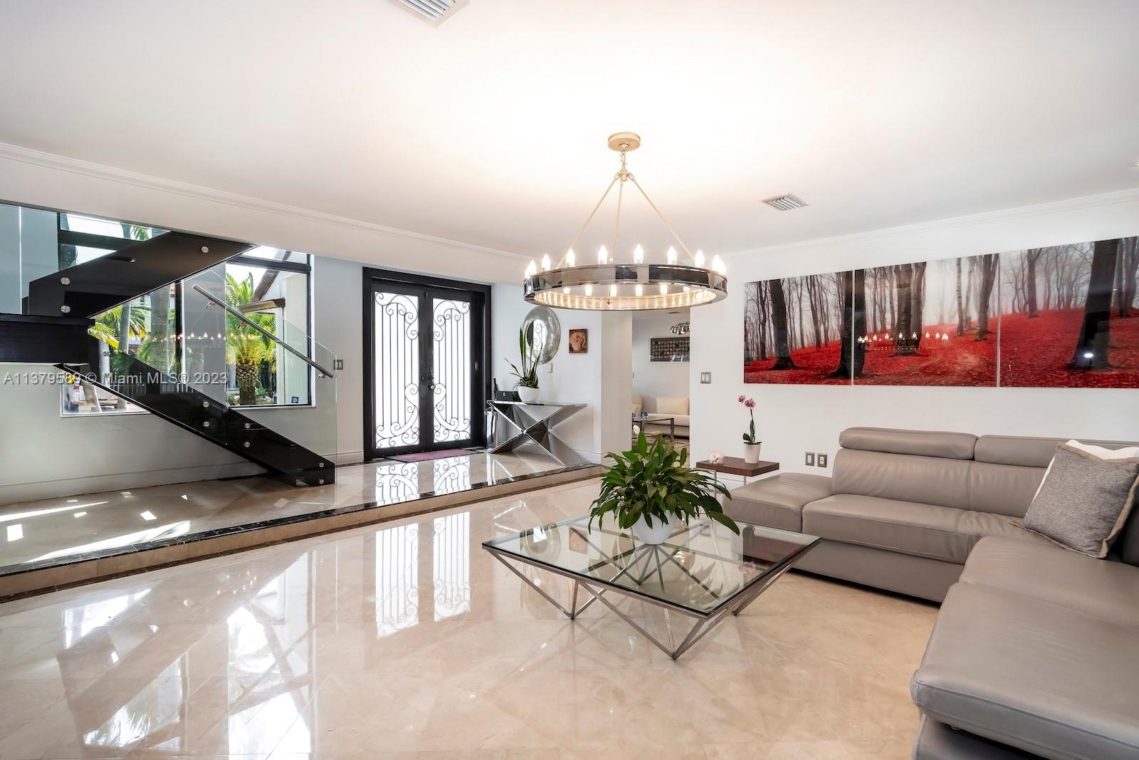 Doral Doral, FL 33178 - Photo 20 of 52 a living room with furniture and a chandelier
