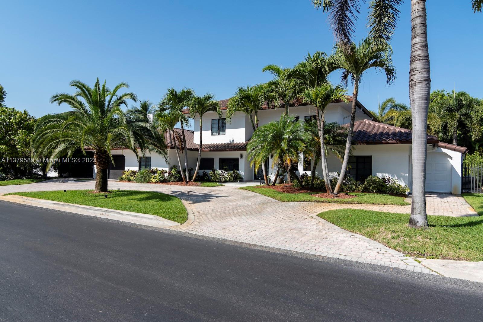 Doral Doral, FL 33178 - Photo 2 of 52 a view of a house with a swimming pool and a yard
