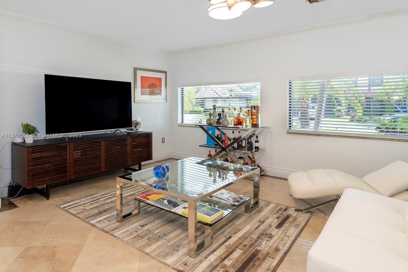 Doral Doral, FL 33178 - Photo 23 of 52 a living room with furniture and a flat screen tv