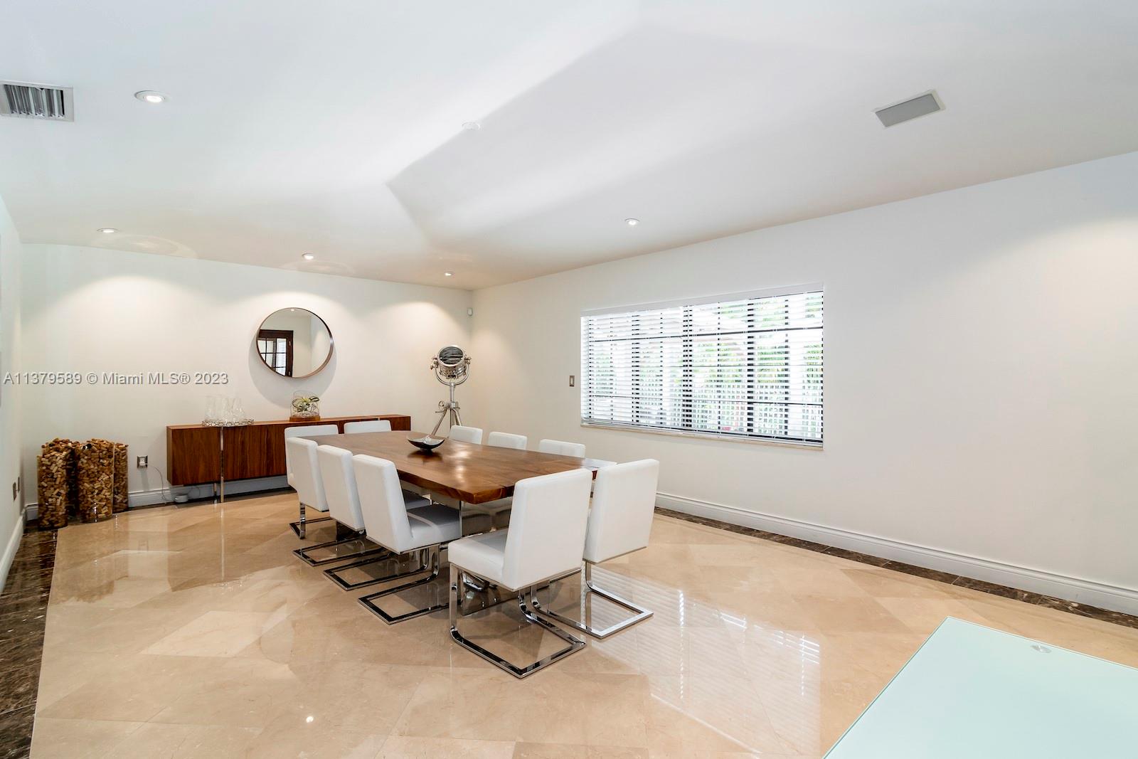 Doral Doral, FL 33178 - Photo 24 of 52 a living room with furniture a rug and white walls