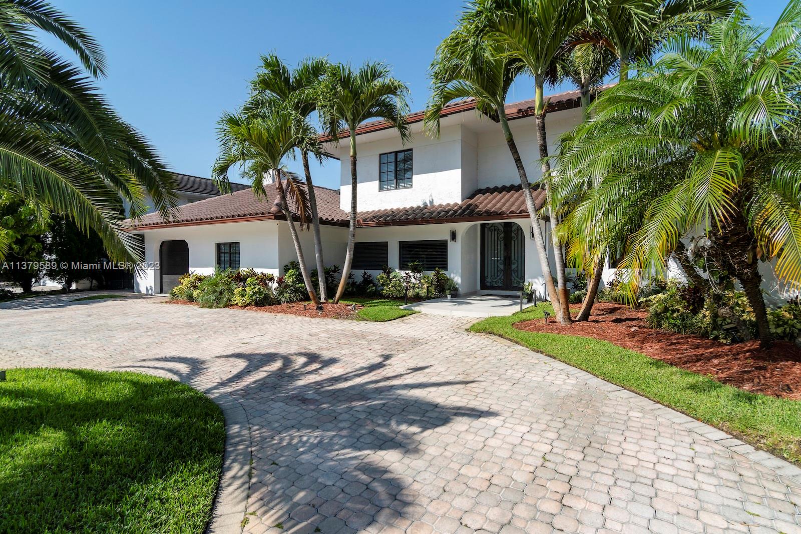 Doral Doral, FL 33178 - Photo 3 of 52 a front view of house with yard and green space
