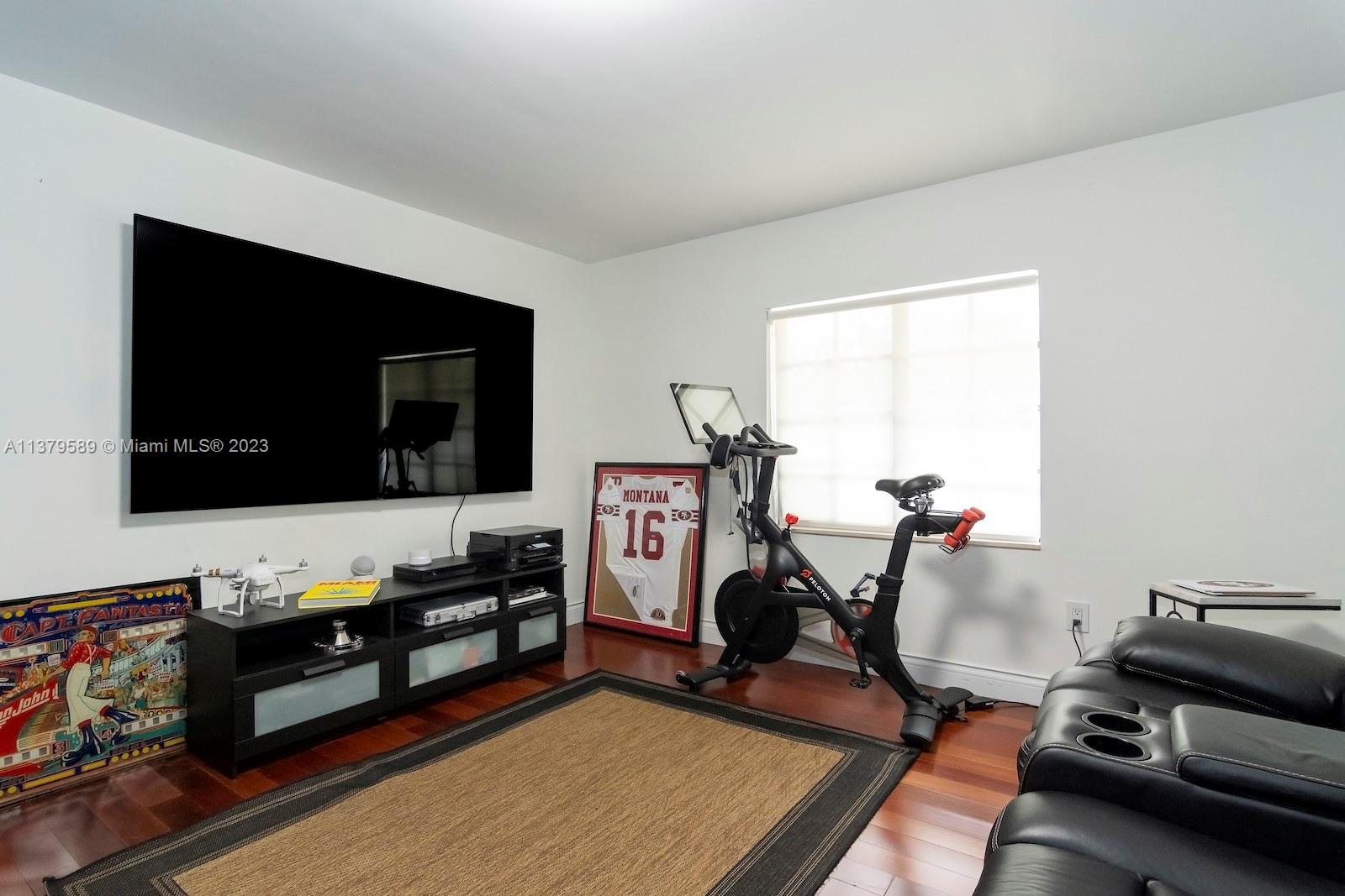 Doral Doral, FL 33178 - Photo 31 of 52 a living room with furniture and a flat screen tv