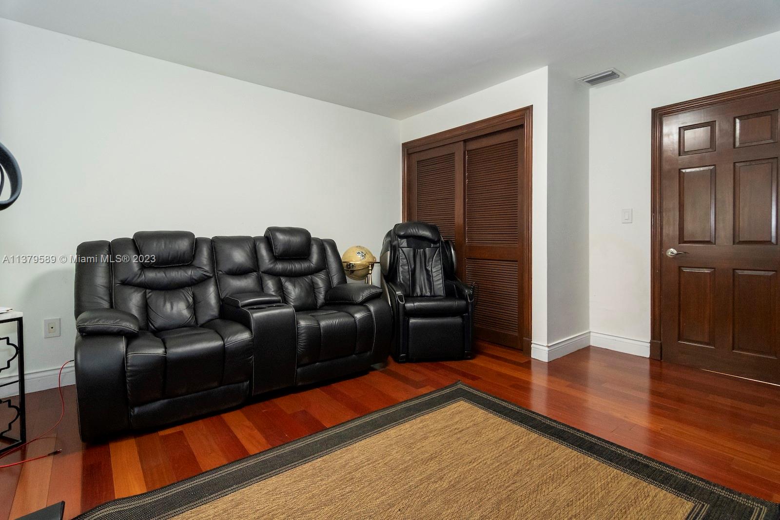 Doral Doral, FL 33178 - Photo 32 of 52 a living room with furniture and wooden floor