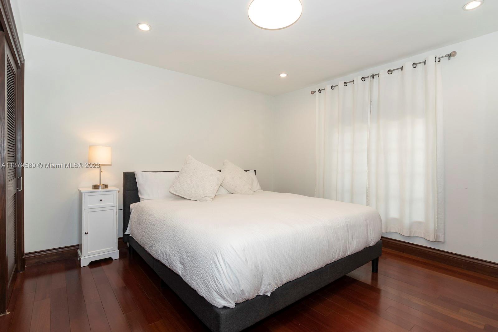 Doral Doral, FL 33178 - Photo 35 of 52 a bedroom with a bed and a window