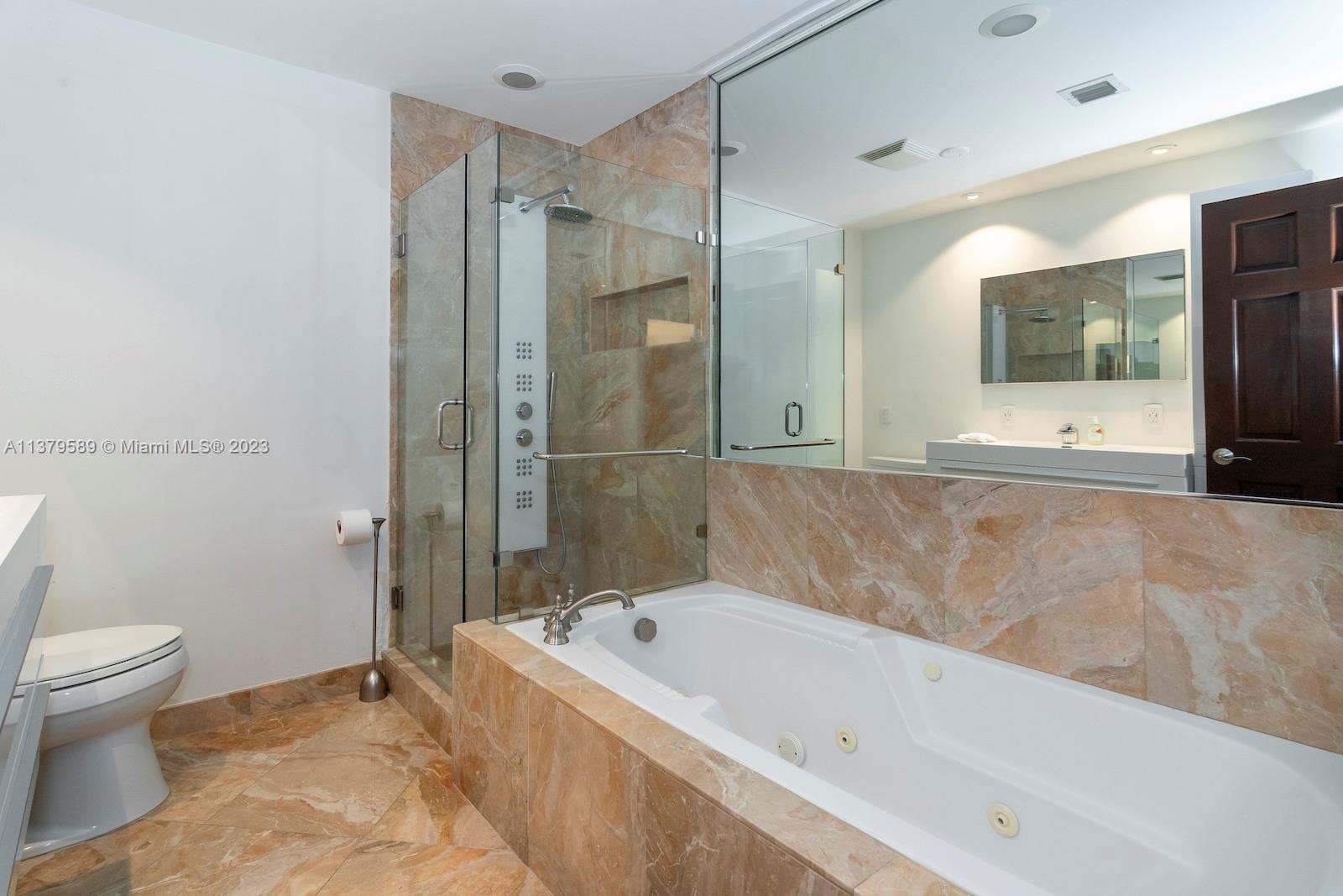 Doral Doral, FL 33178 - Photo 39 of 52 a bathroom with a bathtub and a toilet