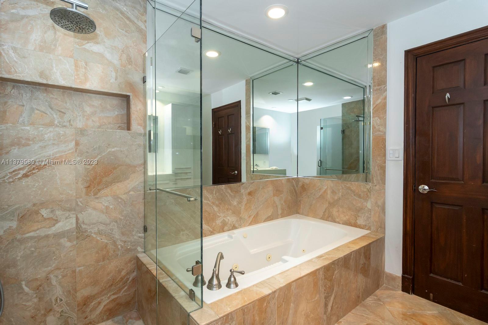 Doral Doral, FL 33178 - Photo 40 of 52 a bathroom with a bathtub and a shower