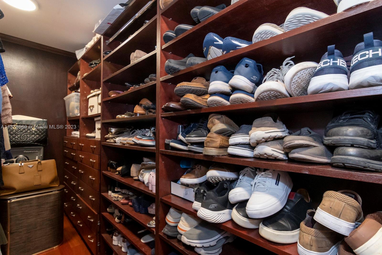 Doral Doral, FL 33178 - Photo 44 of 52 a room with lots of different colored cloths